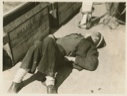 Image of Joe Field asleep on the deck of Bowdoin